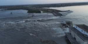 In this image taken from video released by the Ukrainian Presidential Office,water runs through a breakthrough in the Kakhovka dam in Kakhovka,Ukraine.
