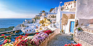 Skyline of Oia,traditional white architecture with windmills,Greek village of Santorini,Greece. 