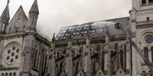 Firefighters put out the fire in a basilica in Nantes,western France,Monday.