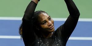 Serena Williams departs from the stage,making a heart to fans after her loss in the US Open.