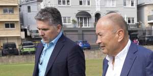Eddie Jones on his old Coogee Oval stomping ground with Rugby Australia’s head of communications,Mark McCartney.