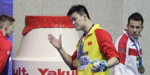 Gold medalist China's Sun Yang confronts Britain's Duncan Scott after a medal ceremony at the world championships. 