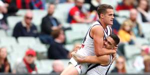 Harley Balic is hugged by fellow Docker Michael Walters after kicking his first AFL goal,in 2017.