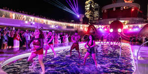 Ship-wide party Scarlet Night comes to life on the pool deck.