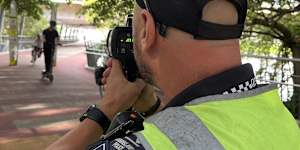 Queensland Police enforcing bicycle and scooter speeds on Brisbane’s Goodwill Bridge.
