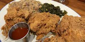 Buttermilk fried chicken with collard greens and Hoppin’ Johns from Poogan’s Porch in Charleston.