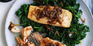 Quick,healthy dinner:Salmon fillets with caramelised onion and wilted greens.