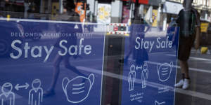 Coronavirus safety posters are displayed in the window of the Sondheim Theatre,London. The city is extended coronavirus restrictions over the Delta variant.