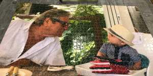 A jigsaw puzzle of Peter and his great-grandson,Oliver.