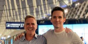 ABC correspondent Bill Birtles and Australian Financial Review reporter Michael Smith leaving China.