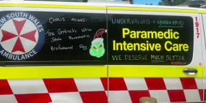 NSW paramedics chalk their ambulances as the eight-month-long pay dispute heads to the IRC.