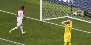 France goalkeeper Hugo Lloris reacts after Croatia's Mario Mandzukic nips in to score.