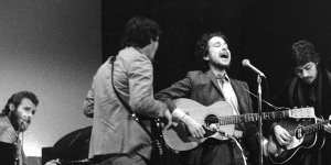 Bob Dylan (centre) performing with Robertson and The Band at Carnegie Hall in 1968.