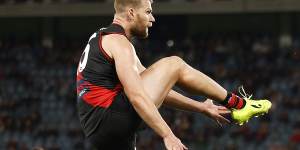 Jake Stringer of the Bombers kicks a goal during the round 20 AFL match between the Essendon Bombers and the North Melbourne Kangaroos at Marvel Stadium on July 31,2022