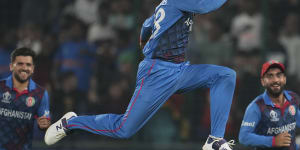 Afghanistan’s Mujeeb ur Rahman celebrates the wicket of England’s Chris Woakes.