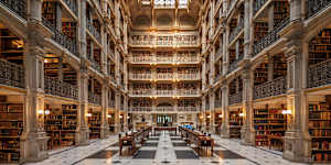 The Peabody Stack Room is a great sky-lit atrium constructed around five tiers of cast-iron balconies.