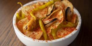 Canned mussels with pickled guindilla peppers and paprika-dusted Pafritas chips.