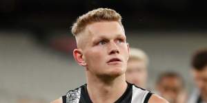 Adam Treloar's trade saga has ended with a move to the Bulldogs. 