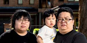 Bin Zhao and Emma Gong and their 2-year-old daughter Chloe outside their house they moved into because it was in Kellyville’s catchment area.