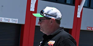 Craig Baills directs his 17-year-old son Angus as he reverses their race car.
