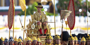 Thailand's King Rama X is carried through the streets of Bangkok during the second day of his coronation ceremony in 2019. 