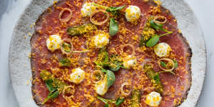 Beef carpaccio with horseradish crème fraiche,fried shallots and grated smoked egg yolk. 