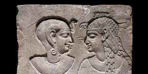 Relief of a mother,possibly a queen,and her son,on show as part of the Pharaoh exhibition at NGV.
