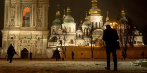 People walk past Saint Sophia Cathedral at Sophia Square in Kyiv,Ukraine. 