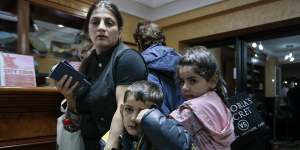 Ethnic Armenians from Nagorno-Karabakh to Armenia wait to be checked into a hotel in Goris,Armenia. 