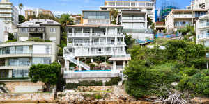 The Jakob family’s $99.5 million site acquisition in Point Piper includes a three-level house with a curved facade (far left),Bruce McWilliam’s recently sold house (centre) and a block of rubble (far right).