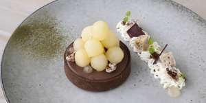 Cocoa tart with poached pear balls,lemon myrtle,Chantilly cream and oabika gel.
