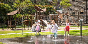 Children play at a playground at the former Pentridge Prison site,which is now a housing development.