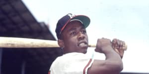 Hank Aaron poses for a photo at Ebbets Field in 1954 while playing for the Milwaukee Braves during an exhibition season in New York.