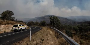 Sydney records hottest day in two years as almost 40 fires burn across NSW