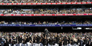 AFL under fire over use of volunteer performers at grand final