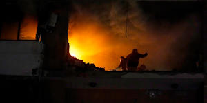 People search for survivors inside an apartment following a massive explosion in the southern Beirut suburb of Dahiyeh,Lebanon.