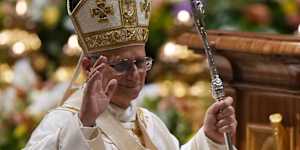 Pope Leo XIV waves after leading the Easter Vigil inside St Peter’s Basilica at The Vatican.