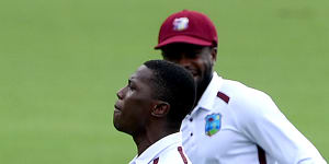 Shamar Joseph celebrates the wicket of Australian captain Pat Cummins.