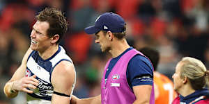 Jeremy Cameron of the Cats leaves the field with an injury.