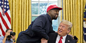 Rapper Kanye West shakes hands with US President Donald Trump during a meeting in the Oval Office of the White House in 2018. 