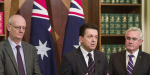 Reverend Tim Costello (left) of the Alliance for Gambling Reform,Senator Nick Xenophon (centre) and Andrew Wilkie MP speak at a press conference outlining their gambling reform agenda for the new parliament on July 14,2016 in Melbourne.