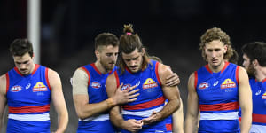 Marcus Bontempelli consoles Josh Bruce after his injury,and after the loss to Essendon. 