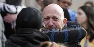 Nic Grzecka,right,co-owner of Club Q,is consoled by a supporter at a ceremony to acknowledge the massacre.