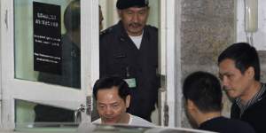 Macau crime boss Wan Kuok Koi,known as Broken Tooth,walks out of Coloane Prison in Macau in 2012.
