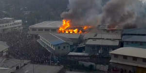Buildings burn in Honiara,the Solomon Islands capital. 