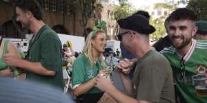 Jess Johnston enjoys St Patricks Day at the Rocks under the shadow of the Harbour Bridge in stiffingly hot conditions. Jess has lived in Sydney for 5.5 years now but is originally from Dublin,Ireland. Sydney,16 March 2025. Photo Jessica Hromas