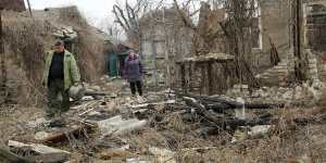 Local citizens visit their home in the separatist-controlled territory to collect belongings after a recent shelling near a frontline outside Donetsk,eastern Ukraine in April. 