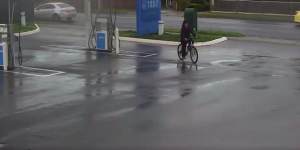 CCTV footage of the man cycling through a petrol station.