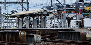 A lone passenger at Macdonaldtown station on a cloudy Friday.