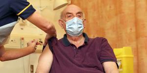 82-year-old Brian Pinker receives the Oxford University/AstraZeneca COVID-19 vaccine on January 4.